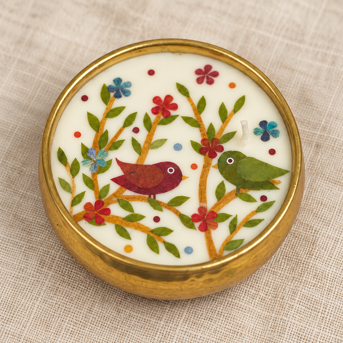 Bird Motif Soy Wax Candle in a Brass Urli, 4 in, close-up of the wax top