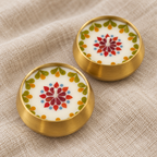 Pressed-Flower Brass Urli Candles, Set of 2, close-up of the wax top