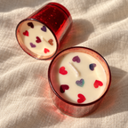 Red Soy Wax Candles with Dried-Rose Hearts, Set of 2, close-up of the wax top