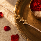 Ivory Birdie — Handcrafted Brass Rakhi