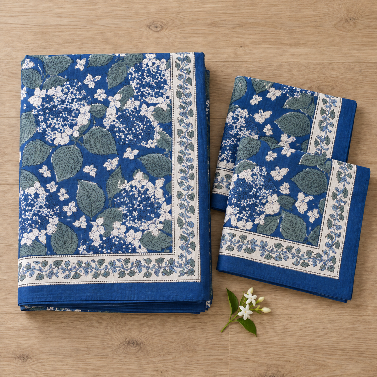 Indigo Blue Floral Bedsheet Set, folded with its pillow covers
