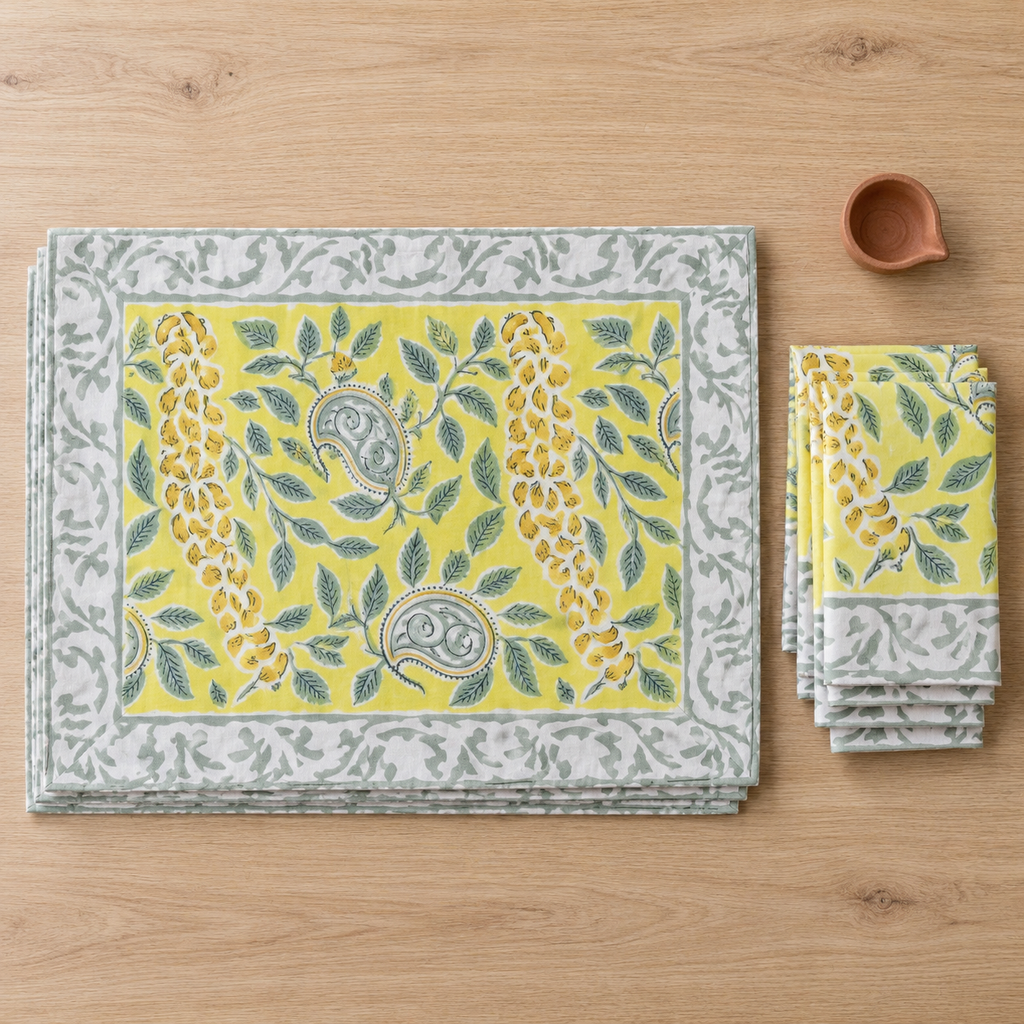Bright Yellow Floral Placemat and Napkin Set of 12, placemats and napkins stacked, seen from above