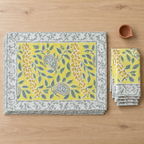 Bright Yellow Floral Placemat and Napkin Set of 12, placemats and napkins stacked, seen from above