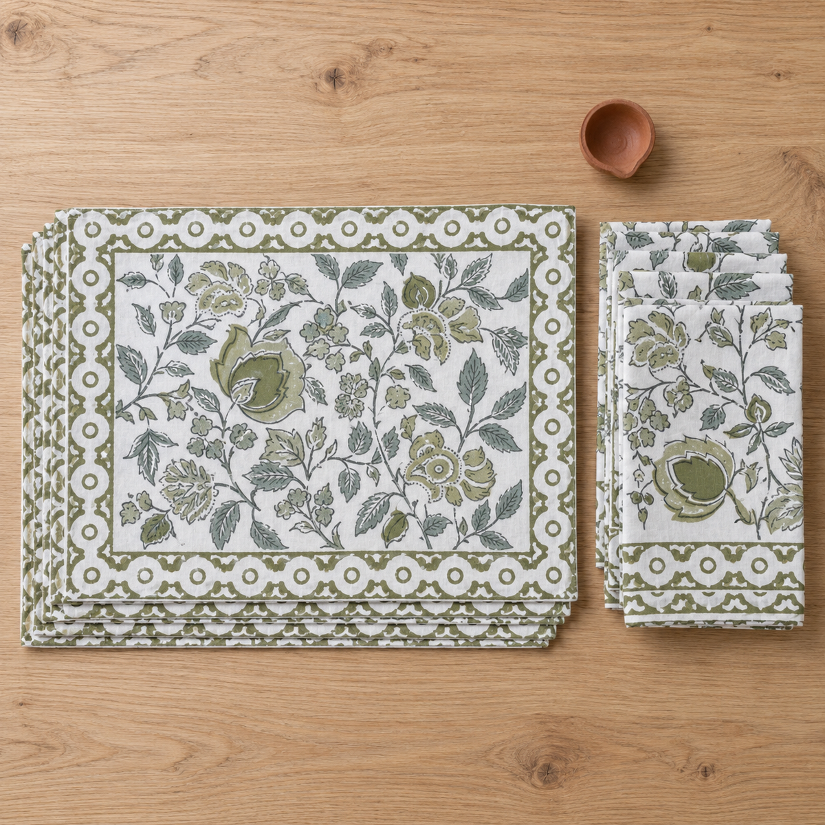 Olive Green Floral Placemat and Napkin Set of 12, placemats and napkins stacked, seen from above