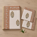 Rust Floral Buta Bedsheet Set, folded with its pillow covers