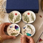 Lavender and Lemongrass Tin Candle Gift Box, Set of 4, being lit by hand