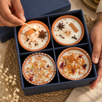 Floral and Spice Terracotta Candle Gift Box, Set of 4, being lit by hand