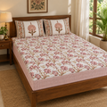 Pink Floral Vine Bedsheet Set, on a made double bed in a bright bedroom