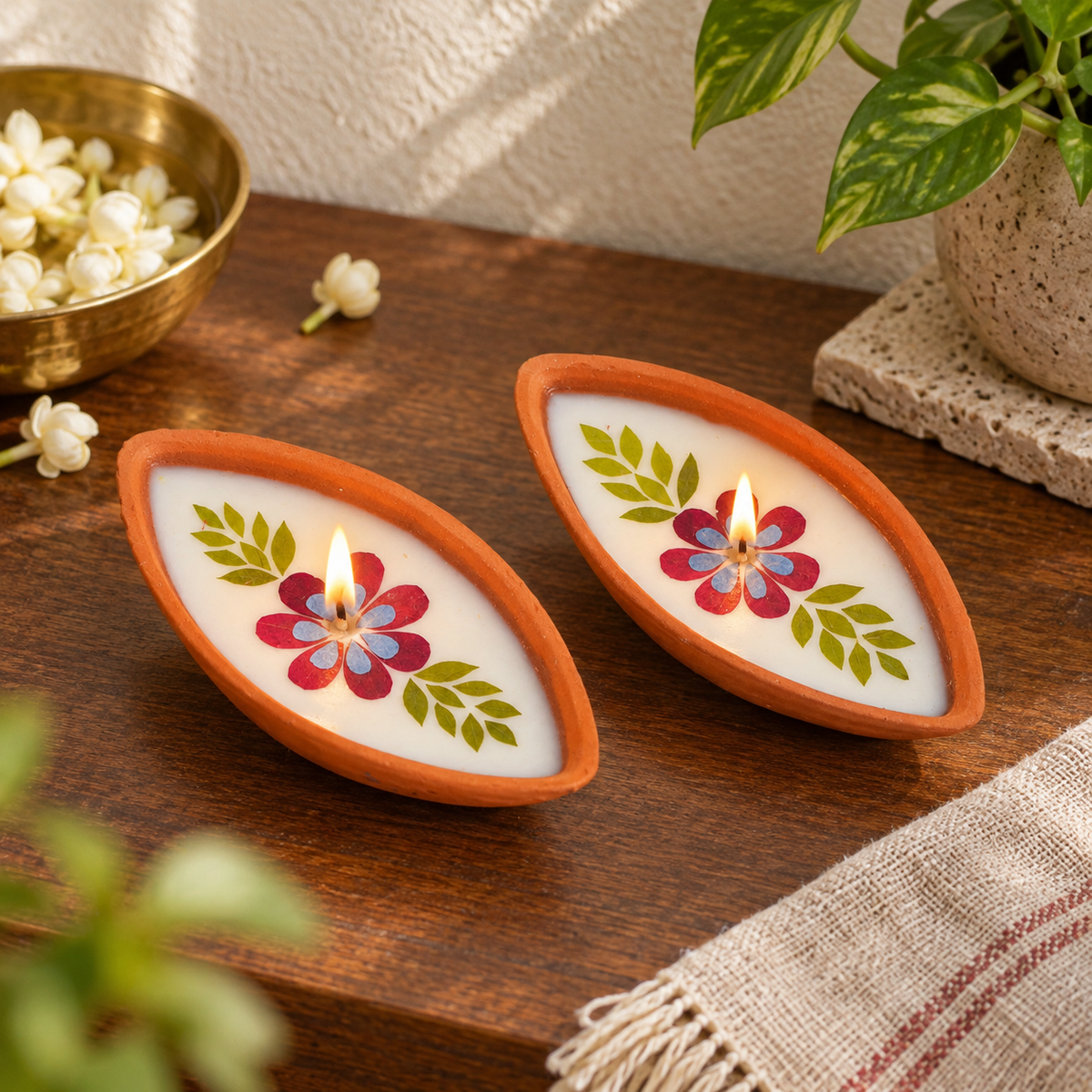 Boat-Shaped Pressed-Flower Terracotta Diyas, in a home in daylight