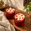 Red Soy Wax Candles with Dried-Rose Hearts, Set of 2, on a teak console in daylight