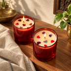 Red Soy Wax Candles with Dried-Rose Hearts, Set of 2, on a teak console in daylight