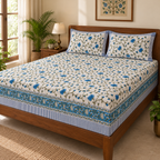 Blue Floral Vine Bedsheet Set, on a made double bed in a bright bedroom