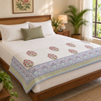 Red Floral Buta Dohar, folded at the foot of a made bed
