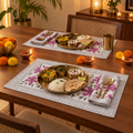 Magenta Floral Placemat and Napkin Set of 12, set for a Diwali meal with brass thalis and diyas
