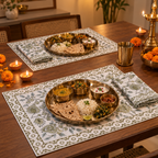 Olive Green Floral Placemat and Napkin Set of 12, set for a Diwali meal with brass thalis and diyas