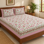 Pink and Green Floral Bedsheet Set, on a made double bed in a bright bedroom