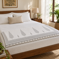 Grey Cypress Dohar, folded at the foot of a made bed