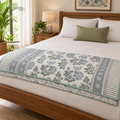 Grey Blue Floral Butterfly Dohar, folded at the foot of a made bed