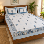 Blue Floral Buta Bedsheet Set, on a made double bed in a bright bedroom